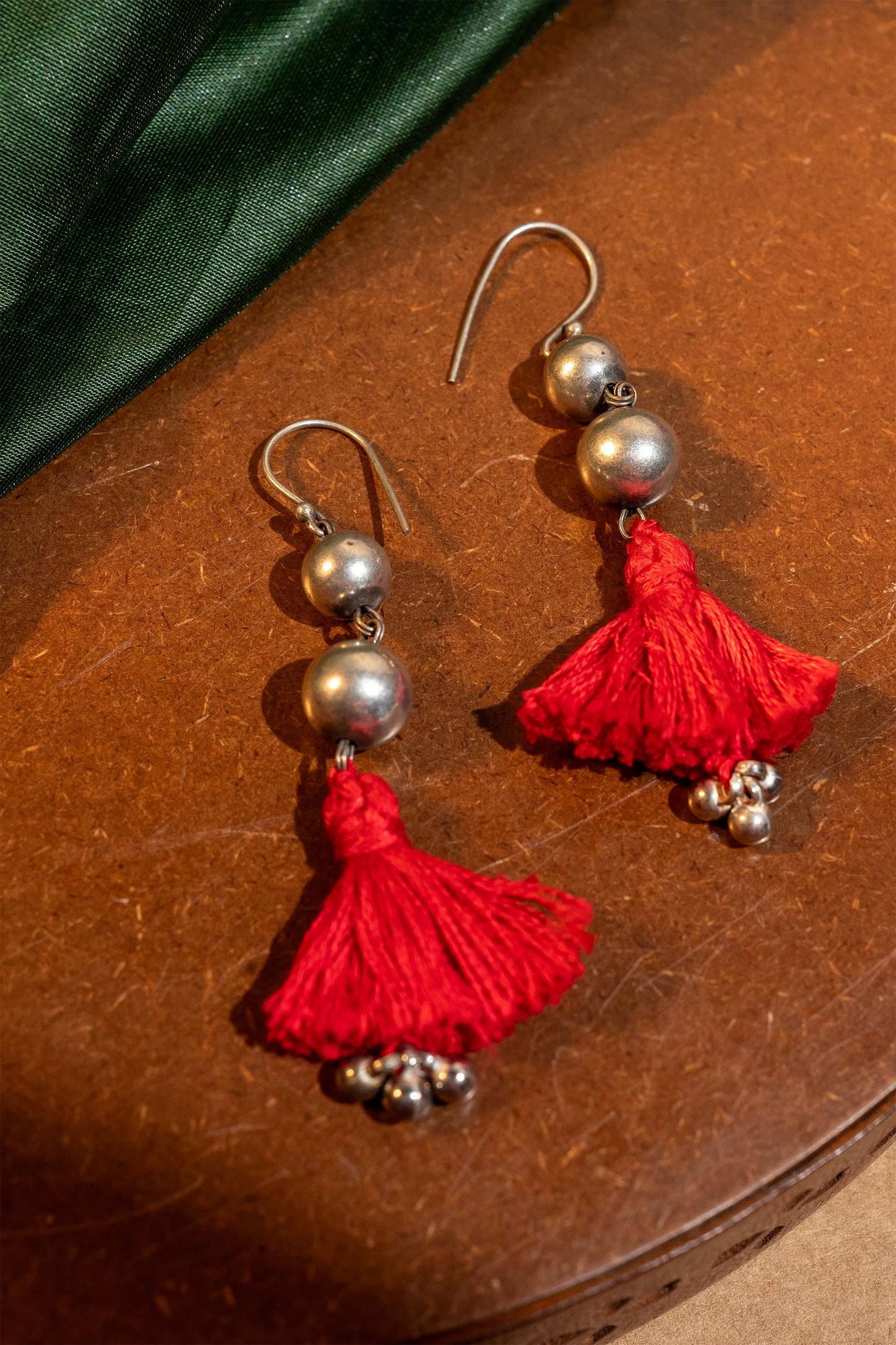 Red Oxidised Ball With Tassels Earring