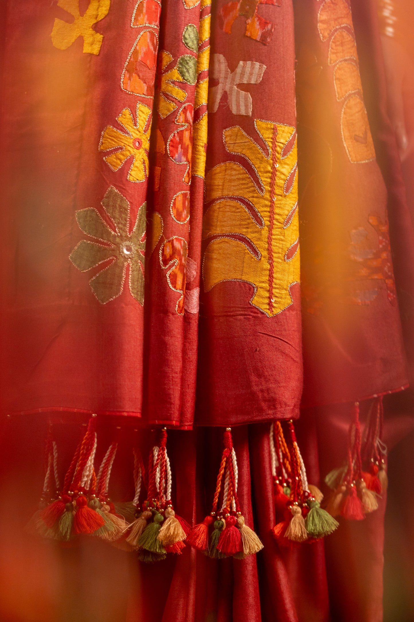 Exclusive Deep Red Satin Silk Saree With Hand-Cut Appliqué & Tassels