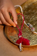 Pink Veena Lumba Rakhi – Handcrafted Thread, Beads & Ghungroo Bhabhi Rakhi