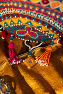 Multicolour handcrafted potli with Aari embroidery, beads and mirror work.