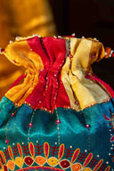 Multicolour handcrafted potli with Aari embroidery, beads and mirror work.