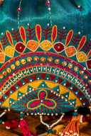 Multicolour handcrafted potli with Aari embroidery, beads and mirror work.