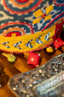 Geometric applique potli bag with brass tikki detailing