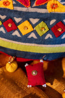 Designer triangular mirror work potli for weddings and festive occasions.