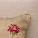 Cotton cushion cover featuring repeating lotus motifs
