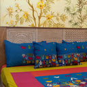 Blue artisan-style cotton bedding set with decorative motifs
