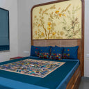 Multicolour bedsheet with decorative houses and figure motifs