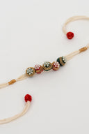 White Riwaayat Rangrez Handmade Rakhi with Five Hand-Embroidered Fabric Beads