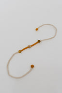 Mustard Karigari Dorr Rakhi – Hand-Braided Handmade Thread & Brass Rakhi