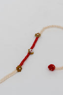Red Karigari Dorr Rakhi – Hand-Braided Handmade Thread & Brass Rakhi