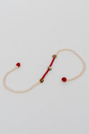 Red Karigari Dorr Rakhi – Hand-Braided Handmade Thread & Brass Rakhi
