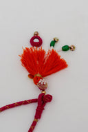 Pink Tarang Lumba Rakhi – Handcrafted Thread, Beads & Mirror Bhabhi Rakhi