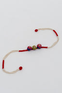 Red Riwaayat Triveni Handmade Rakhi with Hand-Embroidered Fabric Beads