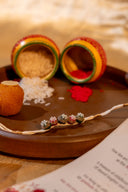 White Riwaayat Rangrez Handmade Rakhi with Five Hand-Embroidered Fabric Beads