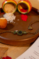 Green Karigari Noor Rakhi – Handcrafted Mirror Work Thread Rakhi