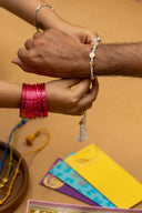 White Karigari Tejas Rakhi – Handcrafted Threads & Brass Rakhi