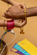 Mustard Karigari Tejas Rakhi – Handcrafted Threads & Brass Rakhi