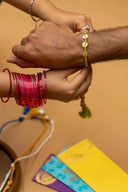 Green Karigari Tejas Rakhi – Handcrafted Threads & Brass Rakhi