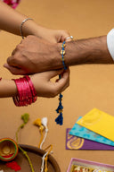 Blue Karigari Ikat Rakhi – Handcrafted Handwoven Ikat Fabric Rakhi