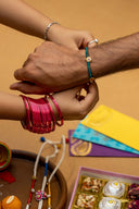 Mint Karigari Dorr Rakhi – Hand-Braided Handmade Thread & Brass Rakhi
