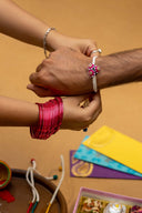 Pink Riwaayat Tara Handmade Rakhi with Hand-Embroidered Floral Fabric Beads