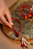 Maroon Tarang Lumba Rakhi – Handcrafted Thread, Beads & Mirror Bhabhi Rakhi