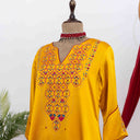 Women's yellow kurta set with Aari and mirror work