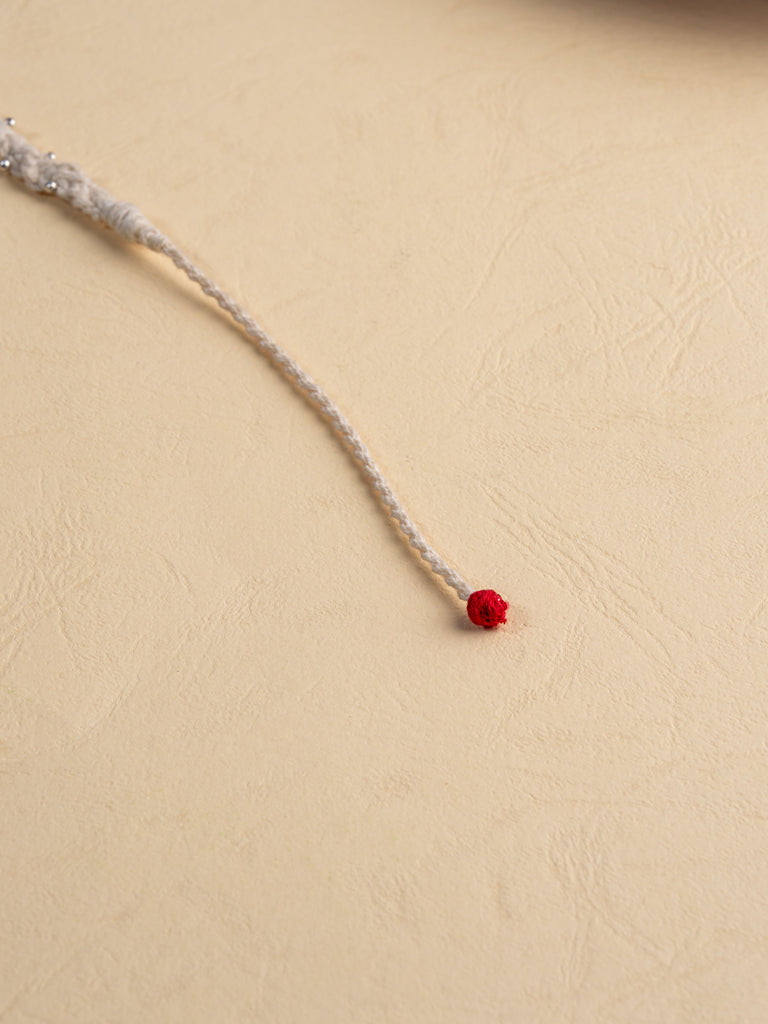 Twisted Elegant White Rakhi