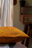 Handcrafted yellow cotton cushion cover with traditional handwork
