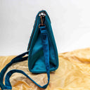 Mint Triangular Rabari Sling Bag with Mirror, Shell & Bead Handwork