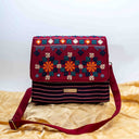 Pink triangular Rabari sling bag with mirror and shell handwork
