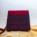 Rabari handwork pink sling bag with mirror and shell detailing
