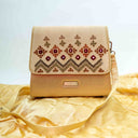 Ivory triangular wave Rabari sling bag with mirror and shell handwork
