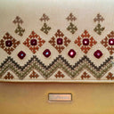 Handmade ivory Rabari sling bag with bead and thread detailing
