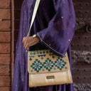 Ivory Triangular Rabari Sling Bag with Mirror, Shell & Bead Handwork